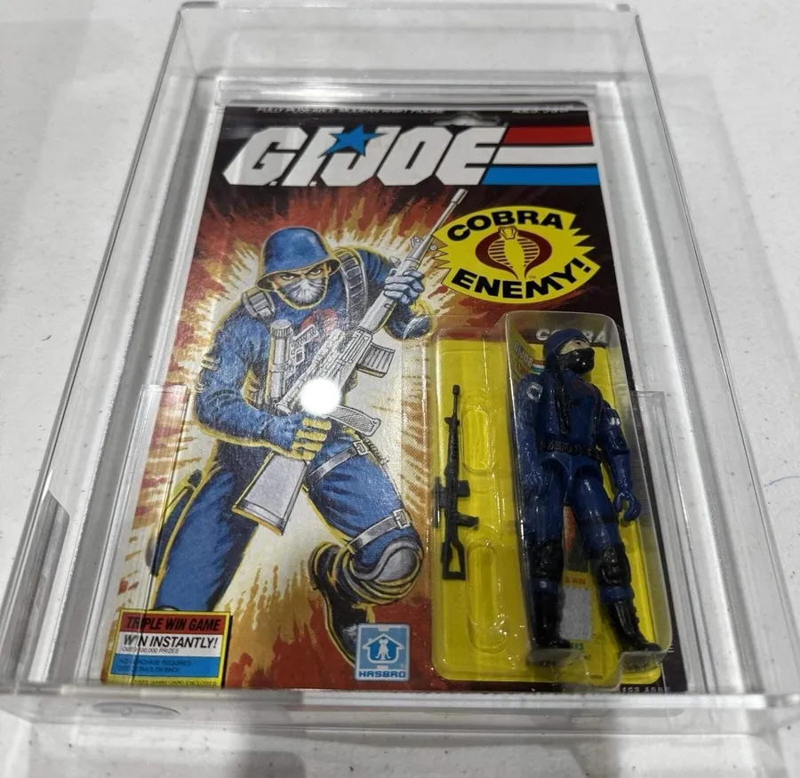 Sealed 1985 Hasbro G.I. Joe Cobra action figure in an AFA case